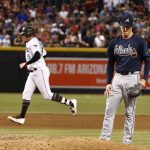 Atlanta Braves' Mike Foltynewicz, right, pauses on the mound after giving up a home run to Arizona Diamondbacks' Taijuan Walker, left, during the fifth inning of a baseball game Tuesday, July 25, 2017, in Phoenix. (AP Photo/Ross D. Franklin)