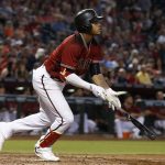 Arizona Diamondbacks' Ketel Marte watches the flight of his fly ball hit the fence against the Atlanta Braves during the third inning of a baseball game Wednesday, July 26, 2017, in Phoenix. Diamondbacks' Marte would get a two-run inside-the-park home run on the play. (AP Photo/Ross D. Franklin)