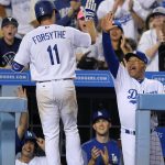 Los Angeles Dodgers' Logan Forsythe, left, is congratulated by manager Dave Roberts after hitting a solo home run during the fifth inning of the team's baseball game against the Arizona Diamondbacks, Thursday, July 6, 2017, in Los Angeles. (AP Photo/Mark J. Terrill)