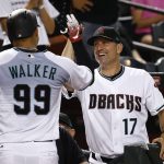 Arizona Diamondbacks' Taijuan Walker (99) celebrates his home run against the Atlanta Braves with manager Torey Lovullo (17) during the fifth inning of a baseball game Tuesday, July 25, 2017, in Phoenix. (AP Photo/Ross D. Franklin)