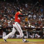 Washington Nationals' Bryce Harper watches the flight of his home run against the Arizona Diamondbacks during the first inning of a baseball game Saturday, July 22, 2017, in Phoenix. (AP Photo/Ross D. Franklin)