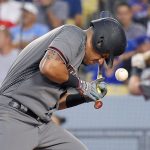 Arizona Diamondbacks' David Peralta is hit by a pitch during the fourth inning of the team's baseball game against the Los Angeles Dodgers, Thursday, July 6, 2017, in Los Angeles. (AP Photo/Mark J. Terrill)