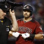 Arizona Diamondbacks' A.J. Pollock, right, looks at umpire Tim Welke after being called out on strikes during the eighth inning of a baseball game against the Washington Nationals, Sunday, July 23, 2017, in Phoenix. (AP Photo/Ross D. Franklin)