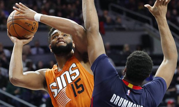 Phoenix Suns forward Alan Williams (15) is fouled by Detroit Pistons center Andre Drummond (0) in t...