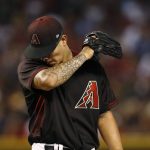 Arizona Diamondbacks pitcher Anthony Banda wipes his face prior to being taken out during the sixth inning of a baseball game against the Washington Nationals, Saturday, July 22, 2017, in Phoenix. (AP Photo/Ross D. Franklin)