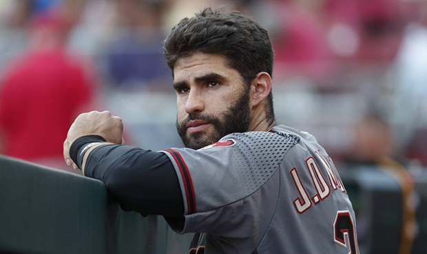 Arizona Diamondbacks right fielder J.D. Martinez stands in the dugout in the first inning of a base...