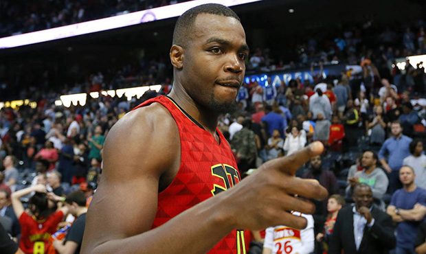 Atlanta Hawks forward Paul Millsap (4) celebrates the overtime victory as he leaves the court after...