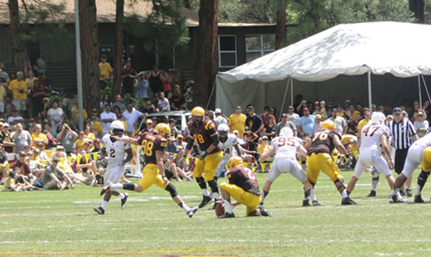 Dillon Jackson attempts a field goal during Saturday's scrimmage at Camp Tontozona. (Photo: Vince M...