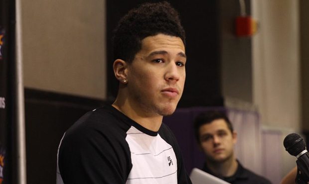 Suns guard Devin Booker talks to the media during exit interviews at Talking Stick Resort Arena in ...
