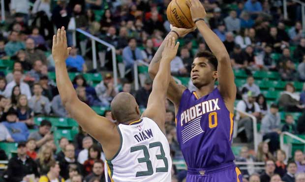 Phoenix Suns forward Marquese Chriss (0) shoots as Utah Jazz center Boris Diaw (33) defends in the ...