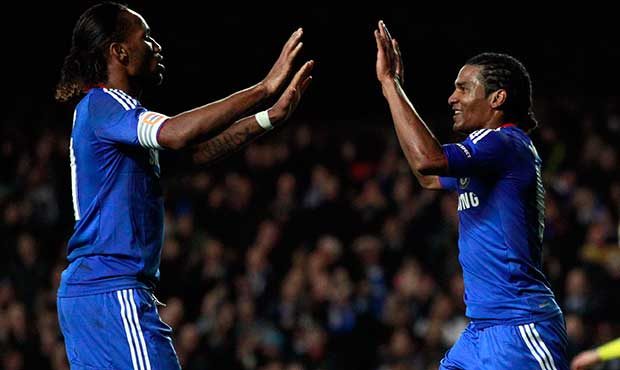 Chelsea's Florent Malouda, right, is congratulated by Didier Drogba after scoring the winning goal ...
