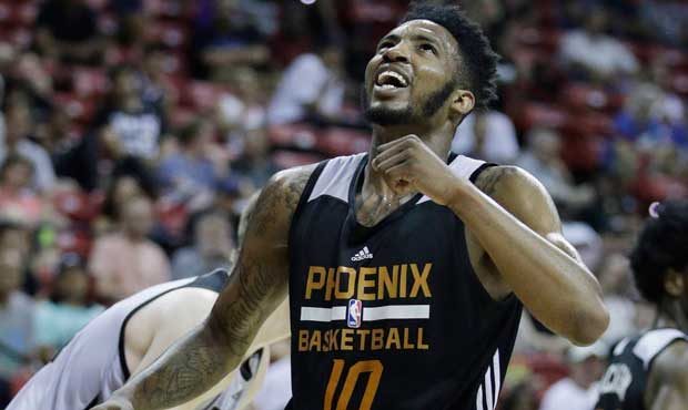 Phoenix Suns' Derrick Jones Jr. reacts after a play during the second half of the team's NBA summer...