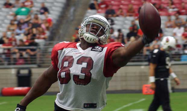 Tight end Gerald Christian reaches for the ball during training camp Aug. 21. (Photo by Adam Green/...