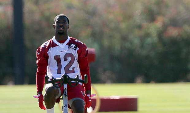 John Brown (12) watches teammates run drills during an NFL football team workout, Wednesday, May 24...