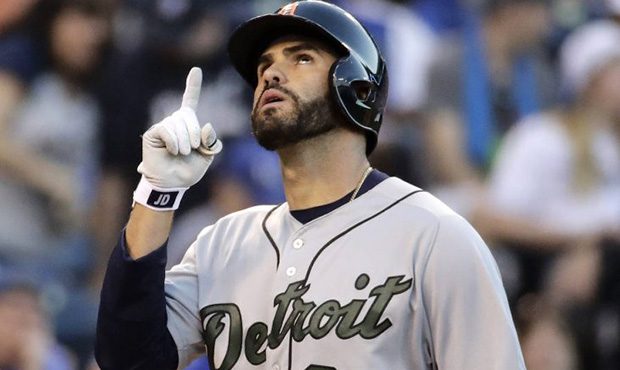 Detroit Tigers' J.D. Martinez, celebrates as he crosses the plate after hitting a three-run home ru...