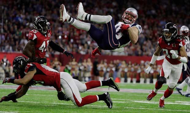 New England Patriots' Julian Edelman is up ended by Atlanta Falcons' Philip Wheeler, during the fir...