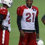 Cornerbacks Patrick Peterson and Justin Bethel laugh during a training camp practice Aug. 1. (Photo by Adam Green/Arizona Sports)