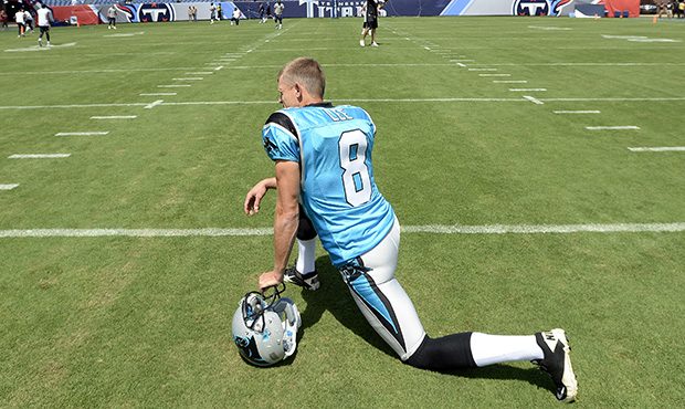 Carolina Panthers punter Andy Lee stretches before an NFL football preseason game against the Tenne...