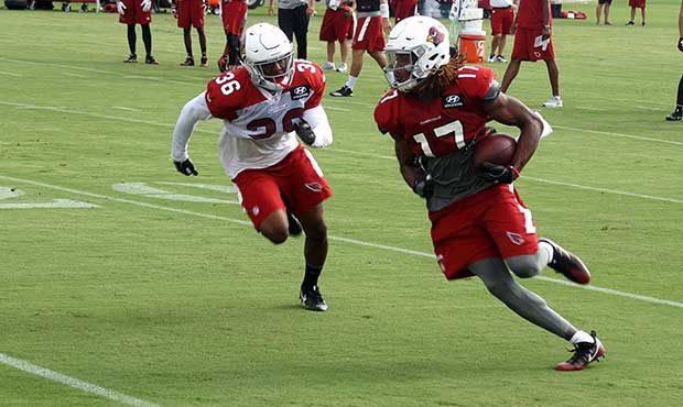 Safety Budda Baker chases down receiver Larry Clark during a training camp practice Aug. 1. (Photo ...