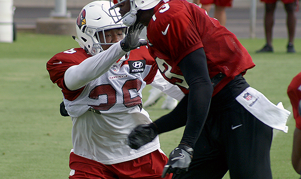 Cardinals safety Budda Baker covers Jaron Brown during a training camp practice Aug. 1. (Photo by A...