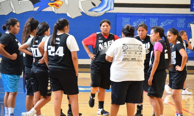 Coach Naomi Lupe of the T3 Natives talks with players during a timeout at the Lori Piestewa Nationa...