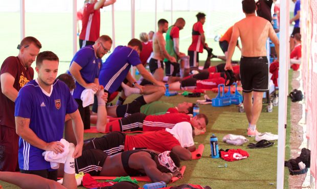 Phoenix Rising FC players go through their new stretching routine after a morning practice. (Photo ...