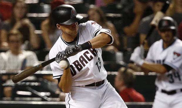 Arizona Diamondbacks' Nick Ahmed gets hit with a pitch against the St. Louis Cardinals during the e...