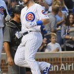 Chicago Cubs' Ian Happ crosses home plate after he hits a solo home run during the second inning of a baseball game against the Arizona Diamondbacks on Tuesday, Aug. 1, 2017, in Chicago. (AP Photo/Matt Marton)