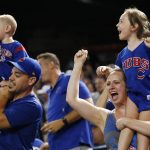 Chicago Cubs fans cheer as the Cubs scored against the Arizona Diamondbacks during the eighth inning of a baseball game Friday, Aug 11, 2017, in Phoenix. (AP Photo/Ross D. Franklin)