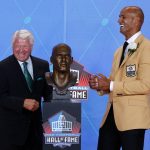 Jason Taylor, right, laughs with his presenter, former coach Jimmy Johnson, as they pose with Taylor's bust during inductions the Pro Football Hall of Fame, Saturday, Aug. 5, 2017,in Canton, Ohio. (AP Photo/Gene J. Puskar)