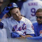 New York Mets Michael Conforto is helped into the clubhouse by team trainer Ray Ramirez after injuring himself swinging his bat during the fifth inning of a baseball game against the Arizona Diamondbacks on Thursday, Aug. 24, 2017, in New York. (AP Photo/Adam Hunger)