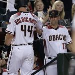 Arizona Diamondbacks Paul Goldschmidt (44) greets manager Torey Lovullo after scoring on a base hit by J.D. Martinez during the sixth inning of a baseball game against the Houston Astros, Monday, Aug. 14, 2017, in Phoenix. (AP Photo/Matt York)