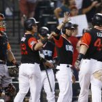 Arizona Diamondbacks' Paul Goldschmidt (44) celebrates his three-run home run with Jake Lamb (22) and Gregor Blanco, second from right, as San Francisco Giants catcher Nick Hundley, left, stands at home plate during the eighth inning of a baseball game Sunday, Aug. 27, 2017, in Phoenix. (AP Photo/Ross D. Franklin)