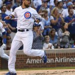 Chicago Cubs' Ben Zobrist (18) scores during the first inning of a baseball game against the Arizona Diamondbacks on Tuesday, Aug. 2017, in Chicago. (AP Photo/Matt Marton)