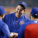 Chicago Cubs' Anthony Rizzo, center, laughs as he talks with teammates before a baseball game against the Arizona Diamondbacks, Saturday, Aug. 12, 2017, in Phoenix. (AP Photo/Ralph Freso)