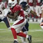 Arizona Cardinals running back Kerwynn Williams (33) is hit by Chicago Bears tight end MyCole Pruitt (83) during the first half of a preseason NFL football game, Saturday, Aug. 19, 2017, in Glendale, Ariz. (AP Photo/Ralph Freso)
