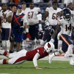 Chicago Bears wide receiver Deonte Thompson (14) runs back a missed field goal for a touchdown as Arizona Cardinals punter Matt Wile (6) defends during the first half of a preseason NFL football game, Saturday, Aug. 19, 2017, in Glendale, Ariz. (AP Photo/Ross D. Franklin)