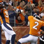 Denver Broncos defensive back Dymonte Thomas (35) celebrates his touchdown against the Arizona Cardinals with defensive back Dante Barnett (2) during the first half of an NFL preseason football game, Thursday, Aug. 31, 2017, in Denver. Thomas intercepted a pass for the touchdown. (AP Photo/Jack Dempsey)