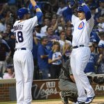 Chicago Cubs' Anthony Rizzo, right, high fives Ben Zobrist (18) after they score on his two-run home run during the second inning of a baseball game against the Arizona Diamondbacks on Tuesday, Aug. 1, 2017, in Chicago. (AP Photo/Matt Marton)