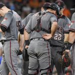 Arizona Diamondbacks starting pitcher Patrick Corbin, left, walks off the mound after being removed from the baseball game during the ninth inning against the Houston Astros, Thursday, Aug. 17, 2017, in Houston. (AP Photo/Eric Christian Smith)