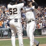San Francisco Giants' Jarrett Parker, right, celebrates after hitting a two-run home run that scored Miguel Gomez (52) against the Arizona Diamondbacks during the second inning of a baseball game in San Francisco, Sunday, Aug. 6, 2017. (AP Photo/Jeff Chiu)
