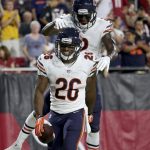 Chicago Bears running back Benny Cunningham (26) celebrates his touchdown with tight end Adam Shaheen (87) during the second half of a preseason NFL football game against the Arizona Cardinals, Saturday, Aug. 19, 2017, in Glendale, Ariz. (AP Photo/Ralph Freso)