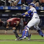 New York Mets catcher Travis d'Arnaud tags out Arizona Diamondbacks' David Peralta (6) during the third inning of a baseball game Wednesday, Aug. 23, 2017, in New York. (AP Photo/Frank Franklin II)