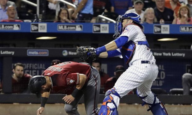 New York Mets catcher Travis d'Arnaud tags out Arizona Diamondbacks' David Peralta (6) during the t...