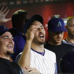 From right to left, Arizona Diamondbacks' Zack Godley, Adam Rosales, Nick Ahmed, and Chris Iannetta celebrate a two-run double by Paul Goldschmidt against the Los Angeles Dodgers during the first inning of a baseball game Thursday, Aug. 31, 2017, in Phoenix. (AP Photo/Ross D. Franklin)