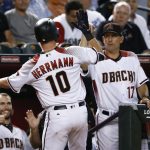 Arizona Diamondbacks' Chris Herrmann (10) celebrates his home run against the Los Angeles Dodgers with manager Torey Lovullo, right, and Paul Goldschmidt, left, during the fourth inning of a baseball game Wednesday, Aug. 30, 2017, in Phoenix. (AP Photo/Ross D. Franklin)
