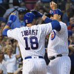 Chicago Cubs' Anthony Rizzo, right, high fives Ben Zobrist (18) after they score on his two-run home run during the second inning of a baseball game against the Arizona Diamondbacks on Tuesday, Aug. 1, 2017, in Chicago. (AP Photo/Matt Marton)