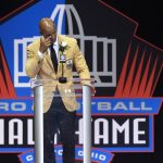 Jason Taylor wipes a tear from his eye as he delivers his speech at his induction, at the Pro Football Hall of Fame on Saturday, Aug. 5, 2017, in Canton, Ohio. (AP Photo/David Richard)