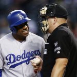 Los Angeles Dodgers' Curtis Granderson, left, argues with umpire Jeff Nelson, right, after being called out on strikes against the Arizona Diamondbacks during the first inning of a baseball game Thursday, Aug. 31, 2017, in Phoenix. (AP Photo/Ross D. Franklin)