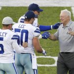 Dallas Cowboys owner Jerry Jones, right, is greeted by Cowboys kicker Dan Bailey (5), outside linebacker Sean Lee (50) and tight end Jason Witten before the Cowboys played the Arizona Cardinals in the Pro Football Hall of Fame NFL preseason game in Canton, Ohio, Thursday, Aug. 3, 2017. Jones is to be inducted into the hall later this month. (AP Photo/Ron Schwane)